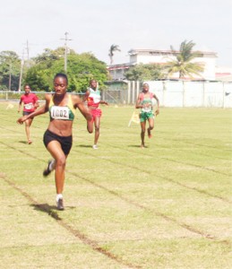 Girl Power! Nadine Rodrigues (wearing 1002) approaches the finish line to take gold ahead of team-mate Roxanna Rigby (far right) in the female 200m on day two of the IGG Track and Field Championship, Suriname&#8217;s Danielle Clark (2nd r) claimed bronze. (Orlando Charles Photo)   